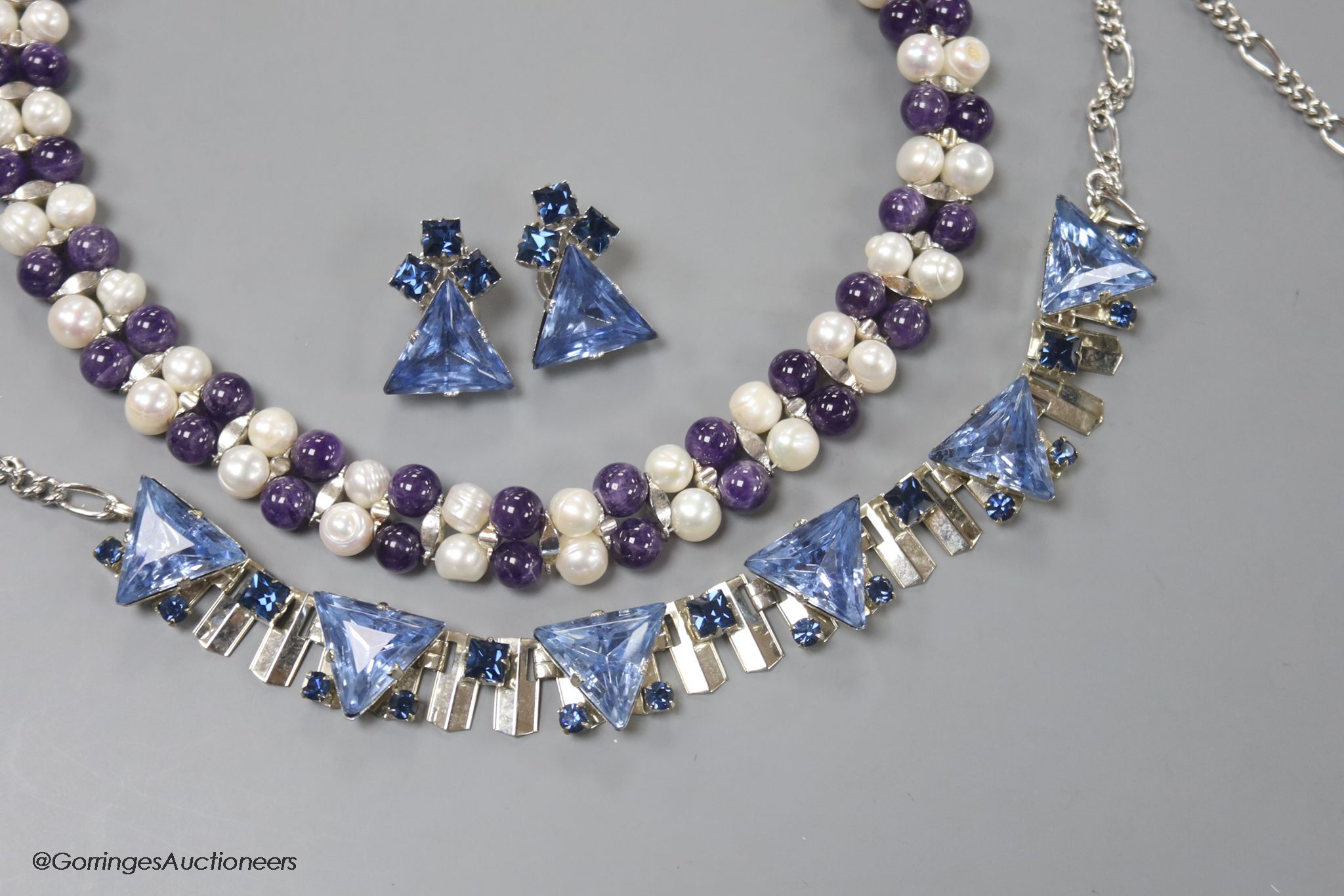 A modern amethyst bead and freshwater cultured pearls necklace and one other paste necklace and pair of earrings.